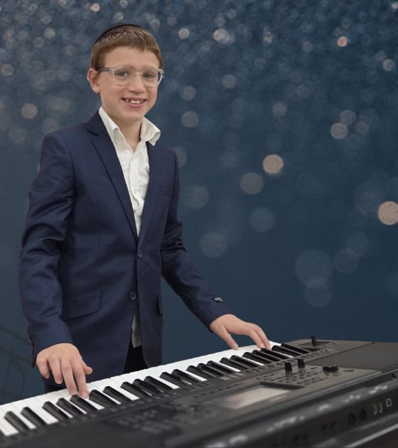 Levi Wagner smiling at his keyboard